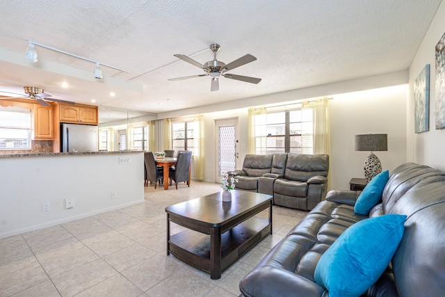 3021 Ventnor Cres, Deerfield Beach, FL 33442 - living room with ceiling fan, rail lighting, light tile patterned floors, a textured ceiling, and baseboards