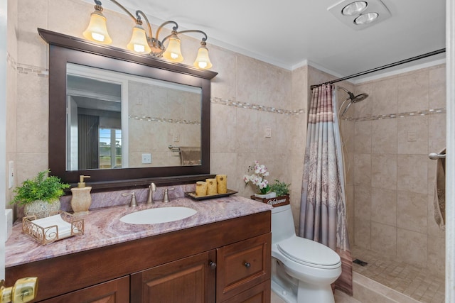 bathroom featuring tile walls, a shower with shower curtain, vanity, ornamental molding, and toilet