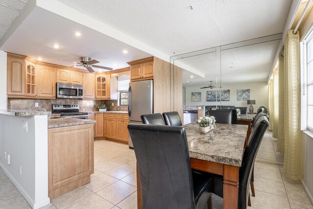 3021 Ventnor Cres, Deerfield Beach, FL 33442 - dining area featuring a ceiling fan, light tile patterned floors, recessed lighting, and a textured ceiling