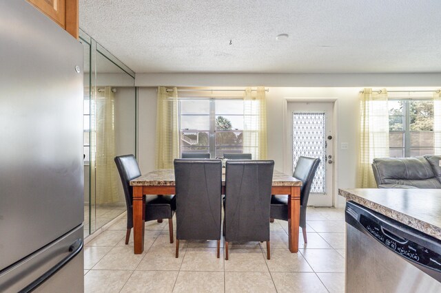 3021 Ventnor Cres, Deerfield Beach, FL 33442 - dining room featuring light tile patterned flooring and a textured ceiling