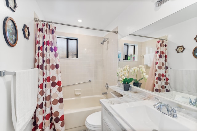 full bathroom featuring shower / bathtub combination with curtain, vanity, toilet, and a healthy amount of sunlight