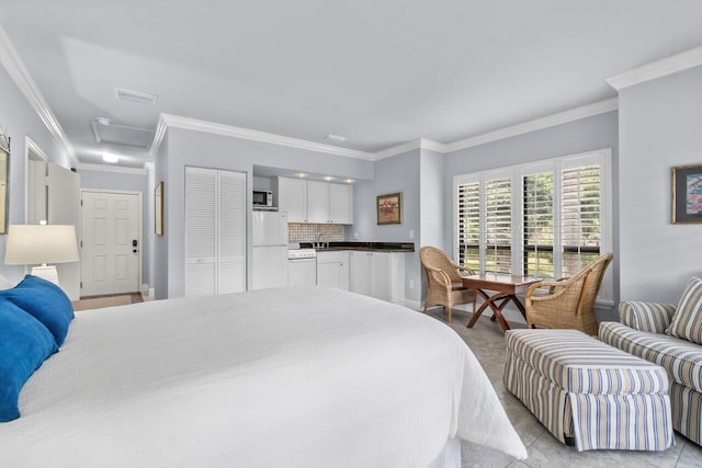 bedroom featuring crown molding and refrigerator