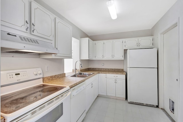 kitchen with sink, white appliances, and white cabinets