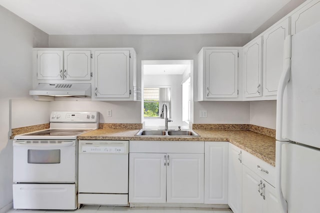 kitchen featuring sink, white appliances, and white cabinets