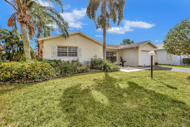 ranch-style house featuring a garage and a front lawn