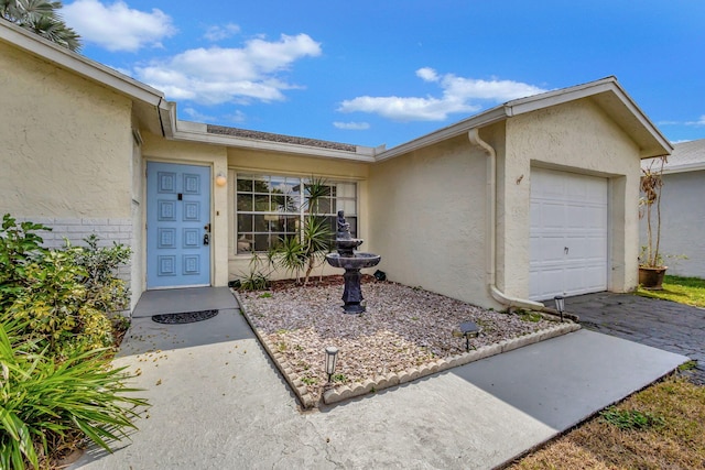 property entrance with a garage