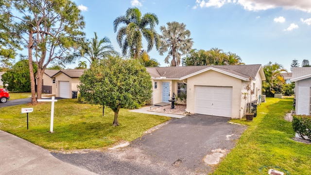 ranch-style home with a garage and a front yard