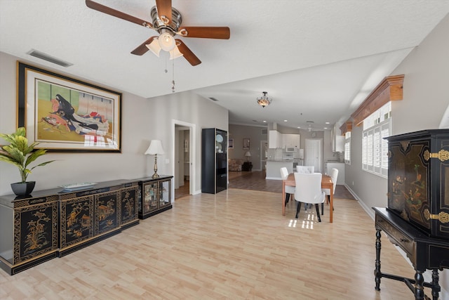 dining room featuring light hardwood / wood-style floors and ceiling fan