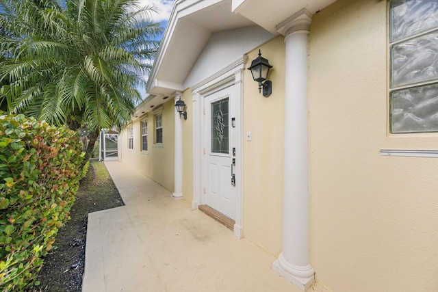 property entrance featuring a patio