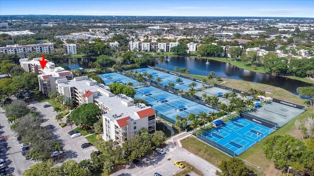 birds eye view of property with a water view