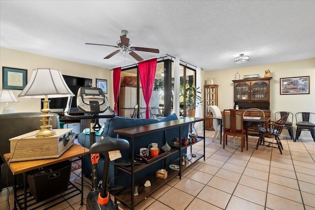 interior space with ceiling fan and a textured ceiling