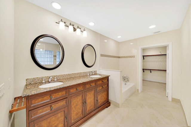 bathroom with vanity and separate shower and tub