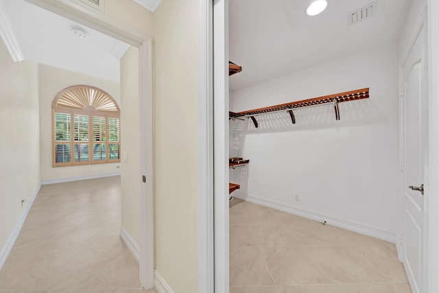 hallway featuring light tile patterned flooring