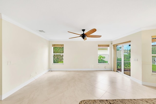 tiled spare room with ornamental molding, a healthy amount of sunlight, and ceiling fan