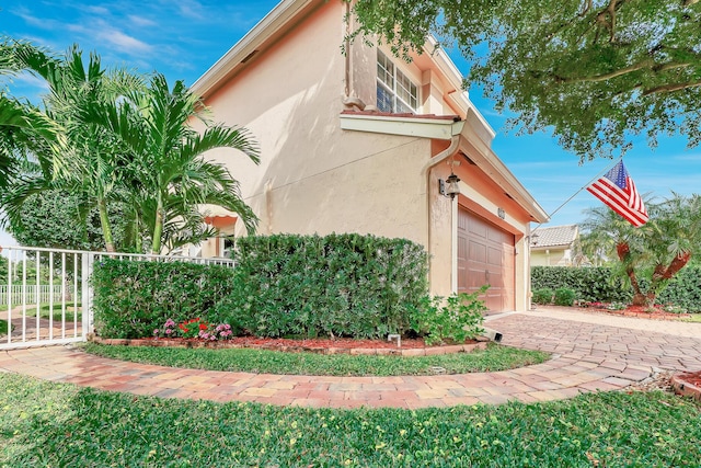 view of property exterior featuring a garage