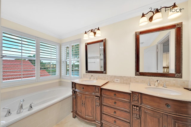 bathroom with tasteful backsplash, ornamental molding, vanity, and tiled tub