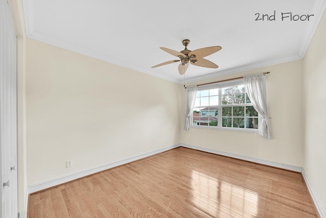 spare room with ceiling fan, ornamental molding, and light hardwood / wood-style floors