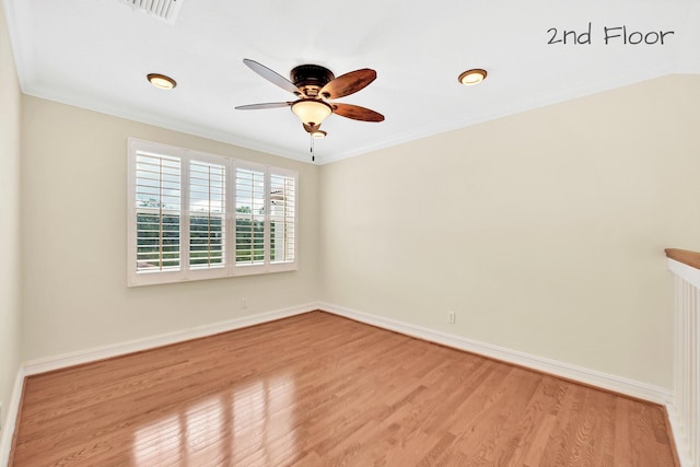 unfurnished room with crown molding, light hardwood / wood-style flooring, and ceiling fan