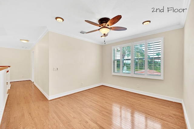 empty room featuring crown molding, ceiling fan, and light hardwood / wood-style flooring