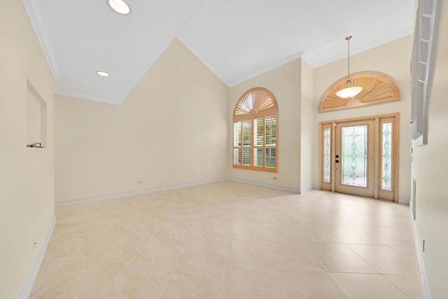 foyer entrance featuring crown molding, vaulted ceiling, and light tile patterned floors