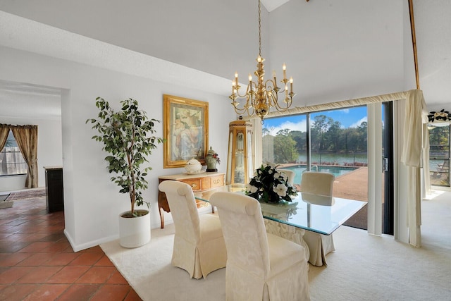 dining room featuring tile patterned floors and an inviting chandelier