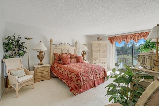 bedroom with light carpet, access to outside, and a textured ceiling