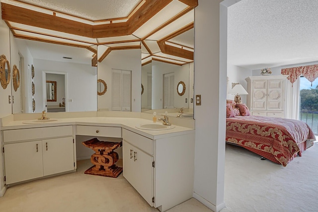 bathroom featuring vanity and a textured ceiling