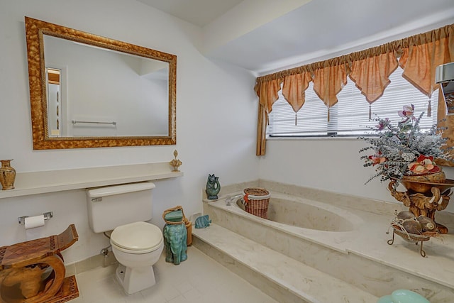 bathroom featuring a bathtub, tile patterned floors, and toilet