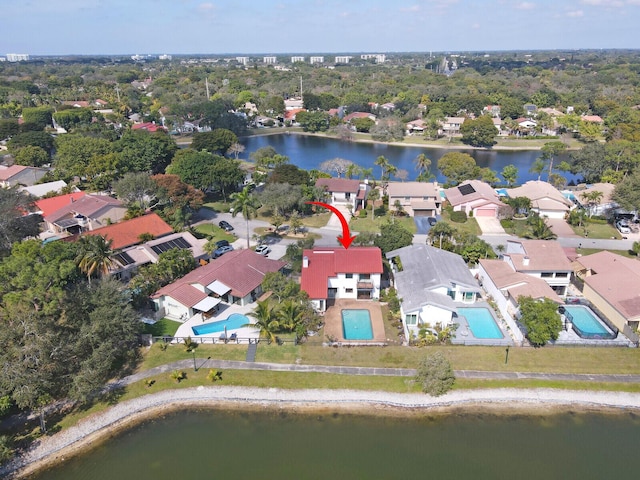 birds eye view of property with a water view