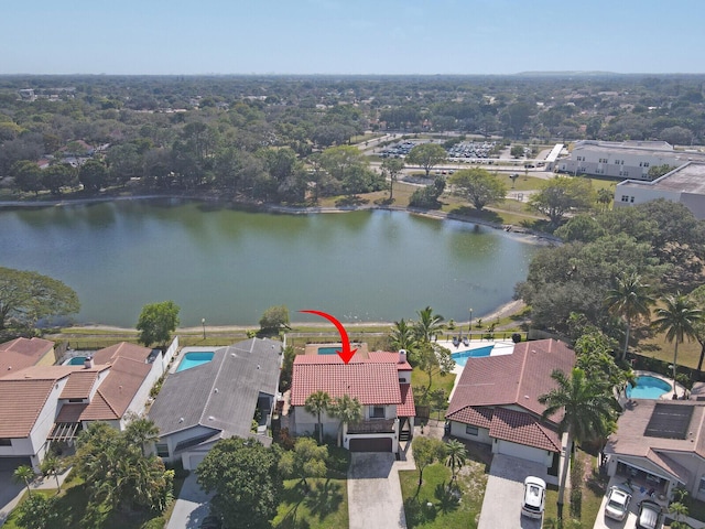 birds eye view of property with a water view