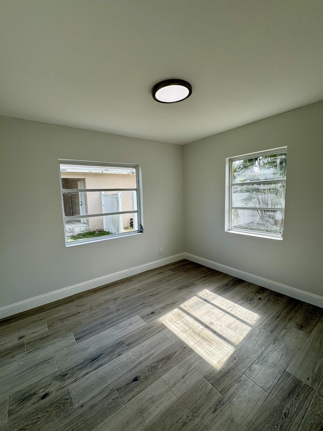 unfurnished room featuring light hardwood / wood-style floors