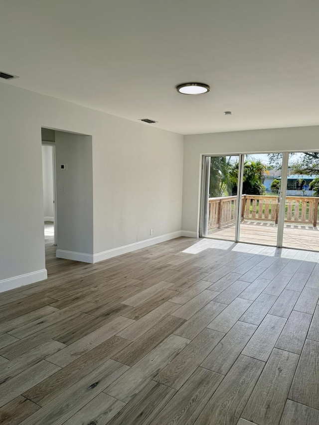 empty room featuring hardwood / wood-style flooring