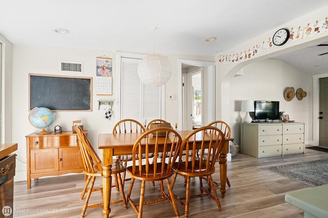 dining area featuring light wood-type flooring