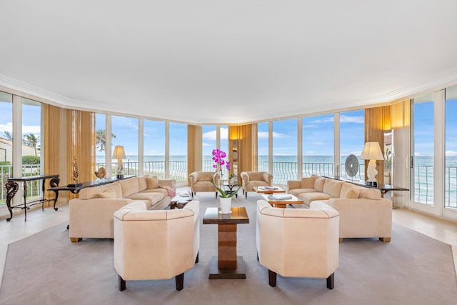 living room with a water view and floor to ceiling windows