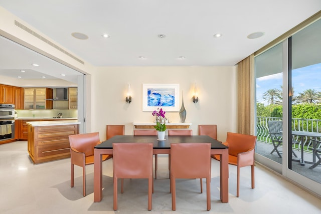 dining area with a wall of windows