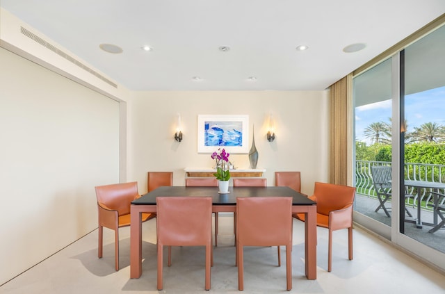 dining area with a wall of windows