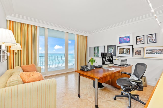 office space with ornamental molding, light parquet flooring, and floor to ceiling windows