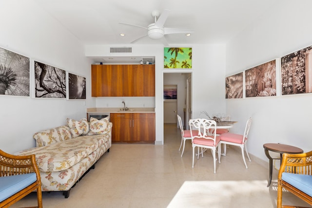 living room featuring sink and ceiling fan