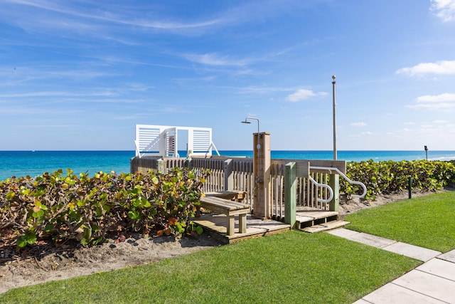 exterior space with a yard and a water view