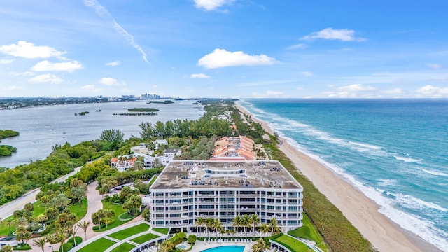 drone / aerial view with a water view and a view of the beach