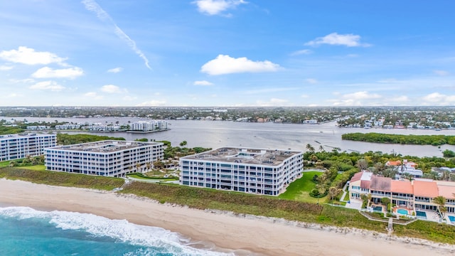 aerial view with a water view and a beach view