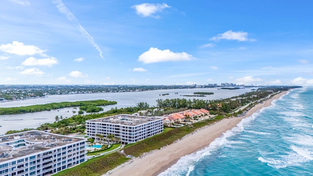 bird's eye view featuring a view of the beach and a water view