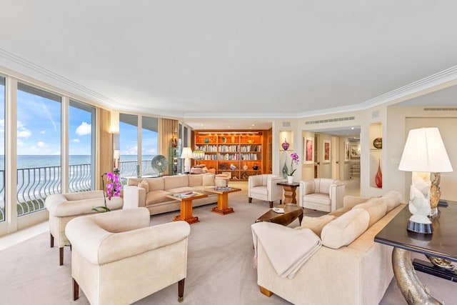 living room featuring a water view, light colored carpet, crown molding, and built in features