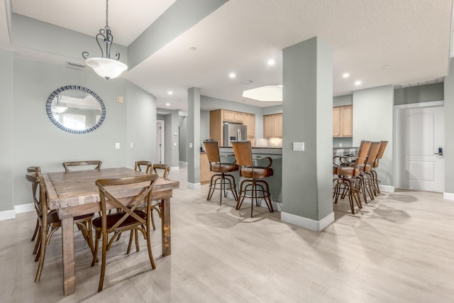 dining area featuring light hardwood / wood-style floors