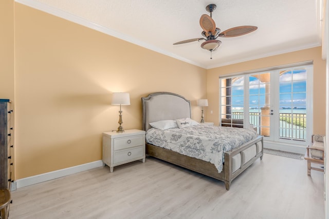 bedroom featuring crown molding, access to exterior, and light hardwood / wood-style floors