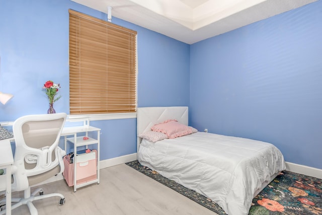 bedroom with light wood-type flooring