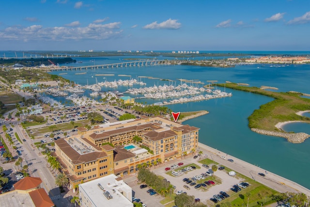 birds eye view of property with a water view