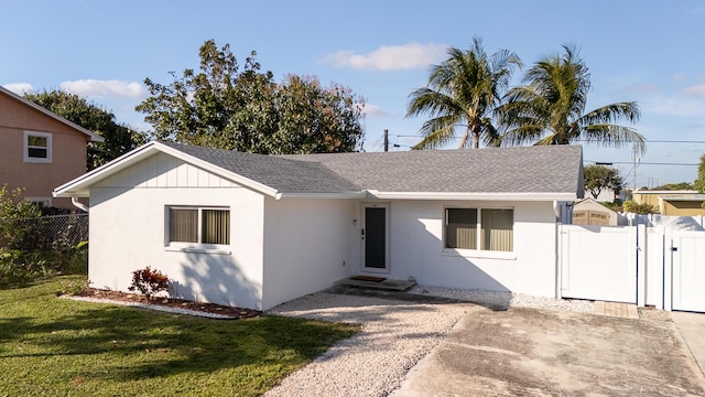 ranch-style home with a front yard