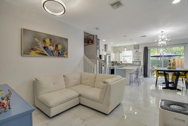 living room with a notable chandelier