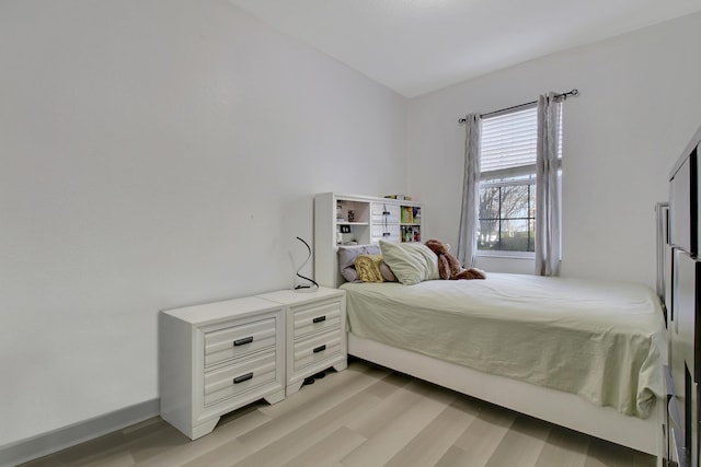 bedroom with light hardwood / wood-style flooring